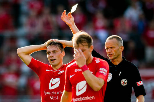 Ruben Yttergård Jenssen of Brann receives a yellow gard of