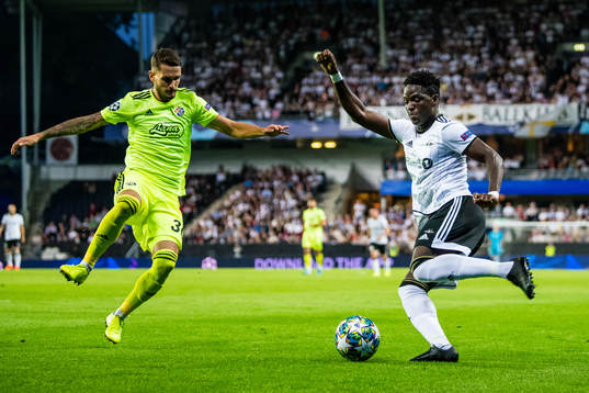 Petar Stojanovic of Dinamo Zagreb and Babajide David