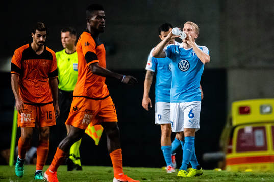 Players of Bnei Yehuda and Oscar Lewicki of Malmö FF