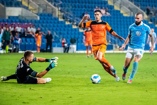 Amit Zenati and goalkeeper Emilijus Zubas of Bnei Yehuda