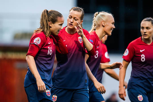 Guro Reiten and Kristine Minde of Norway celebrate