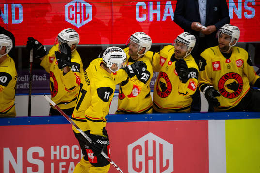 Alain Berger of Bern celebrates with teammates
