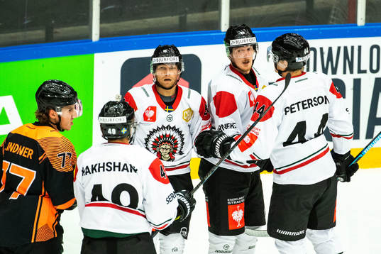 Simon Hjalmarsson of Frölunda celebrate with teammates