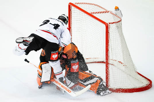 Goalkeeper Thomas Höneckl of Graz99ers saves a penalty
