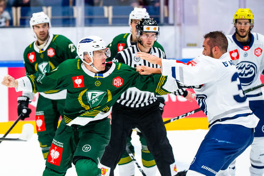 Johan Ivarsson of Färjestad fights Matt D'Agostini of