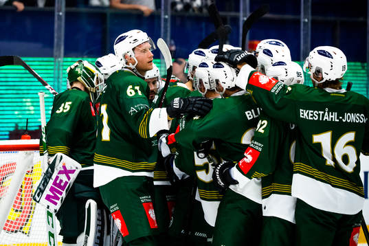 Johan Ryno of Färjestad celebrates with teammates