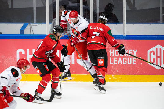 Karl Stollery of Frölunda hits Daniel Rakos  of Mountfield