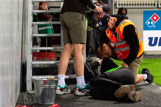 A photographer receives medical attention