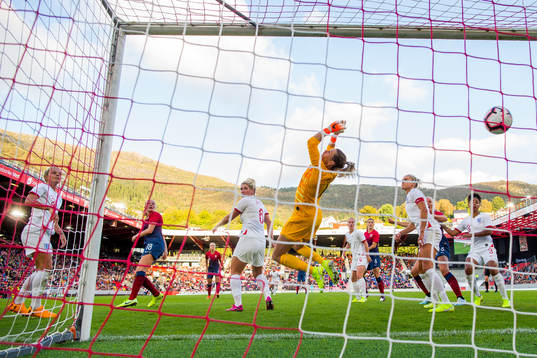 Frida Maanum of Norway scores 1-1 behind goalkeeper Carly