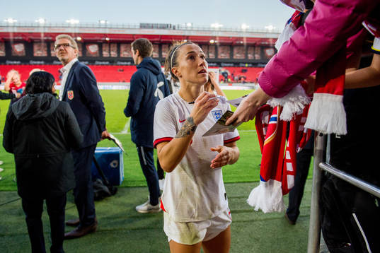 Lucy Bronze of England signs autographs