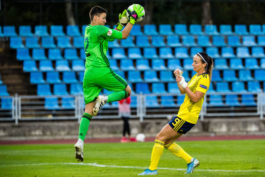 Goalkeeper Marija Ibragimova of Latvia and Kosovare Asllani