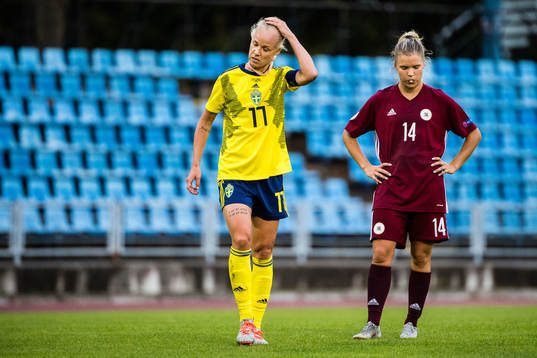 Caroline Seger of Sweden and Olga Sevcova of Latvia looks