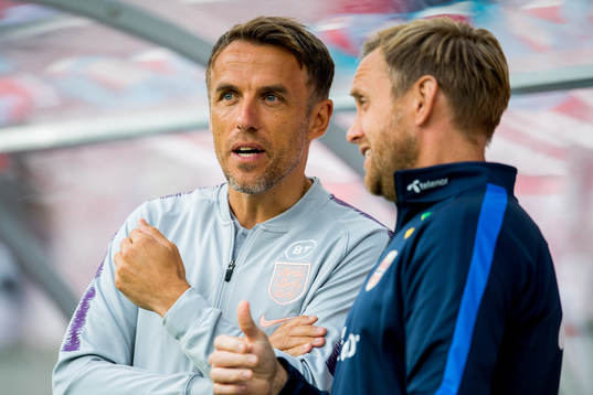 Phil Neville, head coach of England, and Martin Sjögren,