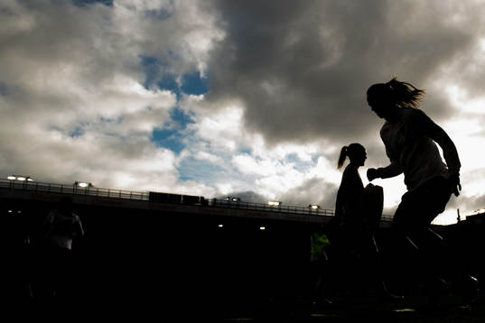 The silhouettes of goalkeeper Ingrid Hjelmseth and Caroline