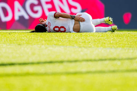 Lucy Bronze of England lies down with an injury