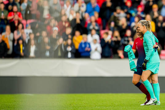 Goalkeeper Ingrid Hjelmseth of Norway with teammate Maren