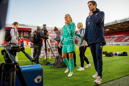 Goalkeeper Ingrid Hjelmseth of Norway and Terje Skeie, head