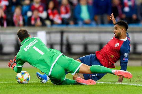 Goalkeeper Henry Bonello of Malta and Joshua King of Norway