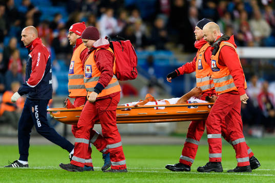 Zach Muscat of Malta leaves the pitch injured