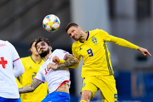 Rene Joensen of Faroe Islands and Marcus Berg of Sweden
