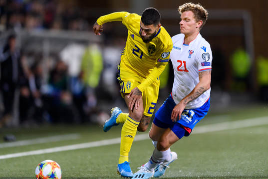 Jimmy Durmaz of Sweden and Meinhard Olsen of Faroe Islands