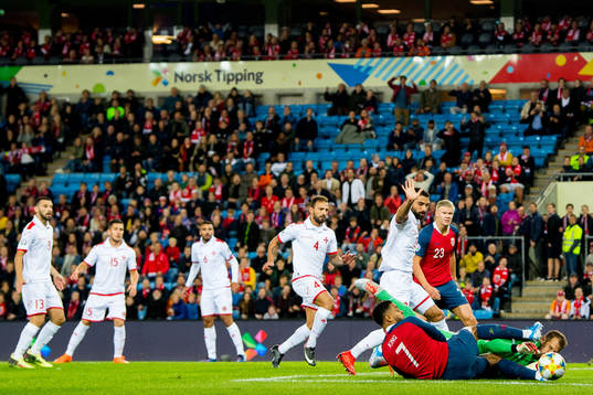 Joshua King of Norway and goalkeeper Henry Bonello of Malta
