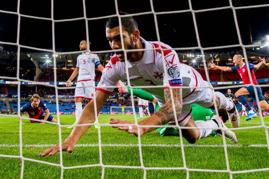 Sander Berge of Norway scores 1-0 as Ferdinando Apap of