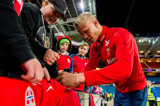 Erling Braut Haaland of Norway signs autographs