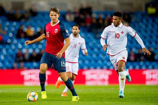 Sander Berge of Norway and Kyrian Nwoko of Malta