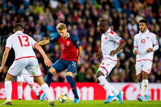 Martin Ødegaard of Norway and Alfred Effiong of Malta