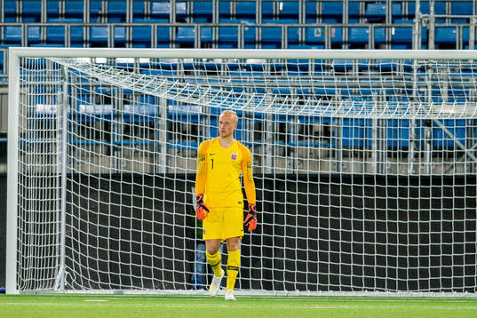 Goalkeeper Julian Faye Lund of Norway looks dejected