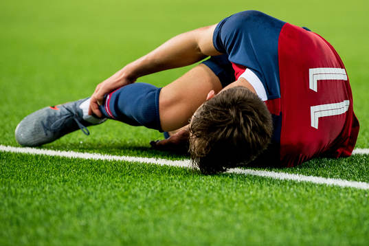 Håkon Evjen of Norway lies down with an injury