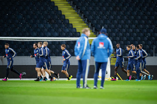 Players of the Swedish national football team warm up