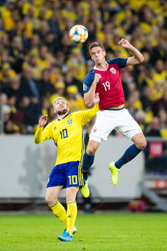 Emil Forsberg of Sweden battles for the ball with Markus