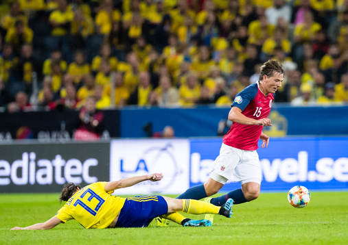 Gustav Svensson of Sweden battles for the ball with Sander