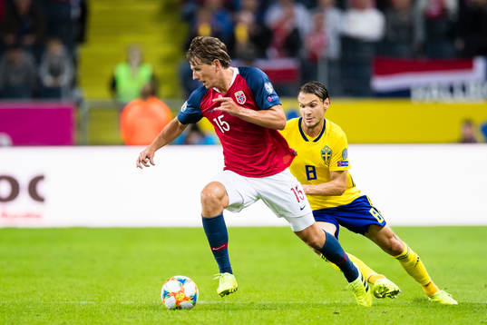 Sander Berge of Norway battles for the ball with  Albin
