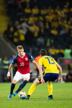 Martin Ødegaard of Norway against Gustav Svensson of Sweden