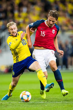 Emil Forsberg of Sweden and Sander Berge of Norway compete