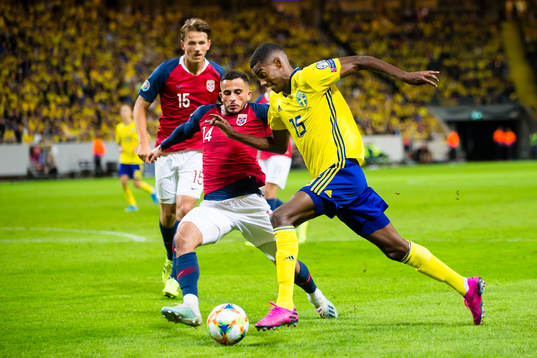 Alexander Isak of Sweden battles for the ball with Omar
