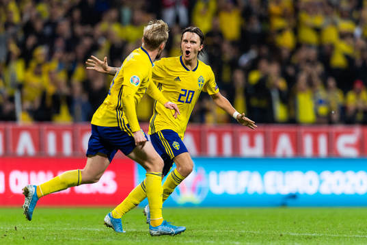 Emil Forsberg and Kristoffer Olsson of Sweden celebrate