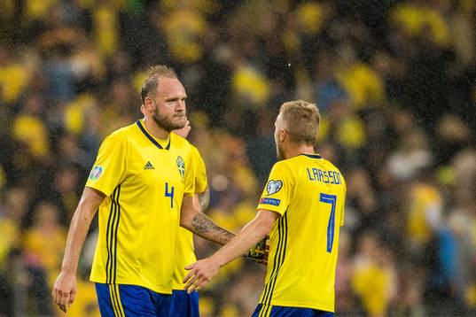Andreas Granqvist and Sebastian Larsson of Sweden look