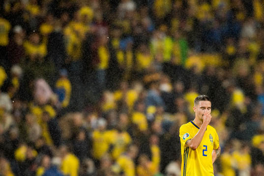 Mikael Lustig of Sweden looks dejected
