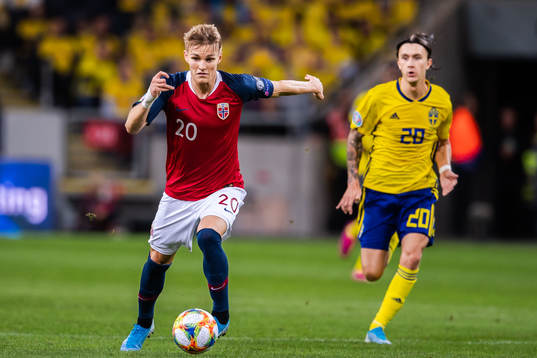 Martin Ødegaard of Norway and Kristoffer Olsson of Sweden