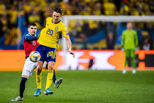 Tarik Elyounoussi of Norway and Kristoffer Olsson of Sweden