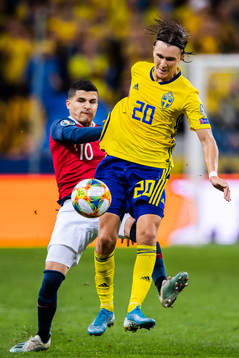 Tarik Elyounoussi of Norway and Kristoffer Olsson of Sweden