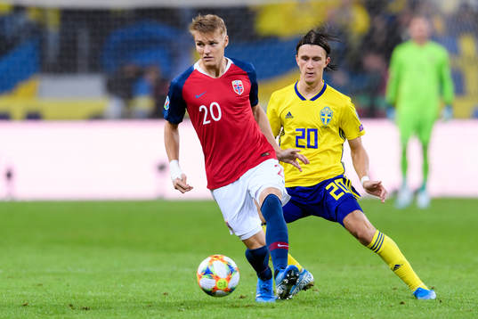 Martin Ødegaard of Norway and Kristoffer Olsson of Sweden