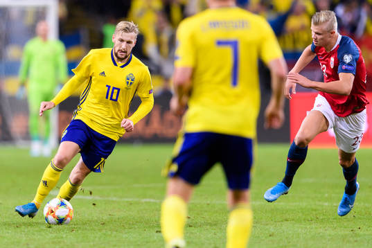 Emil Forsberg of Sweden and Erling Braut Haaland of Norway