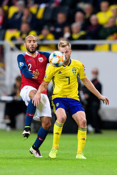 Haitam Aleesami of Norway and Sebastian Larsson of Sweden