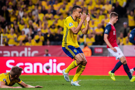 Sebastian Larsson and Robin Quaison of Sweden look dejected