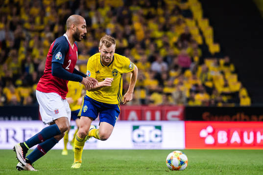 Haitam Aleesami of Norway and Sebastian Larsson of Sweden